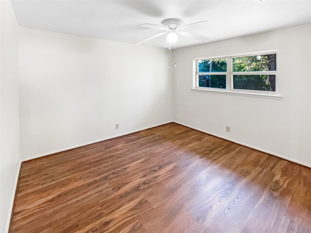 spare room featuring ceiling fan and hardwood / wood-style flooring