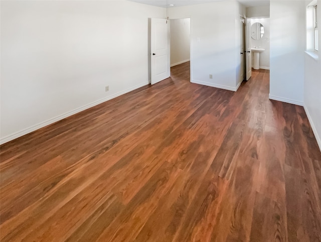 spare room with dark wood-type flooring