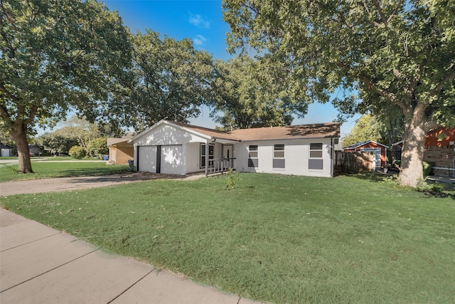 single story home with a front lawn and a garage