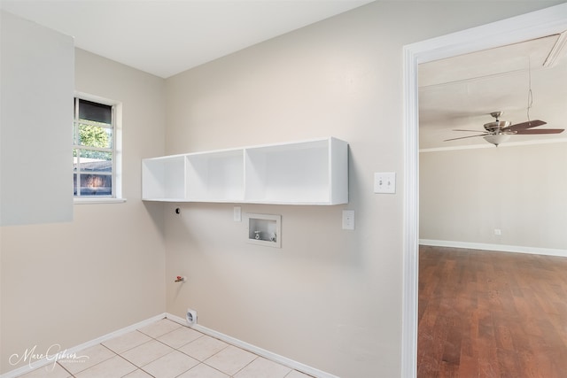 washroom with ceiling fan, hookup for a gas dryer, light hardwood / wood-style floors, and hookup for a washing machine