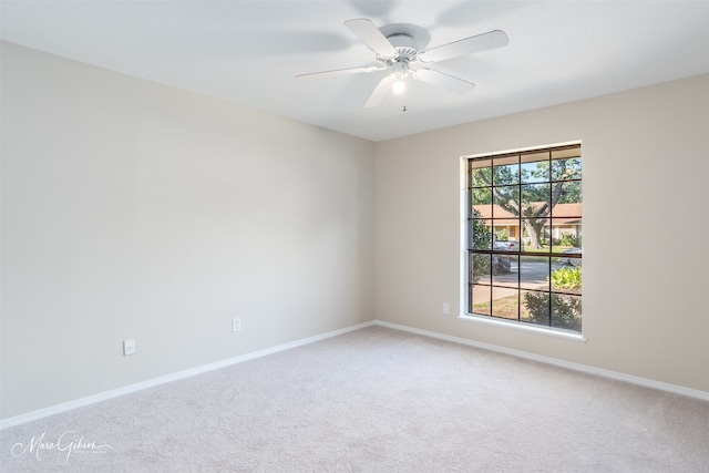 carpeted empty room with ceiling fan