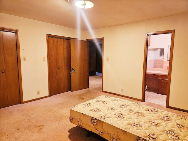 carpeted bedroom with connected bathroom