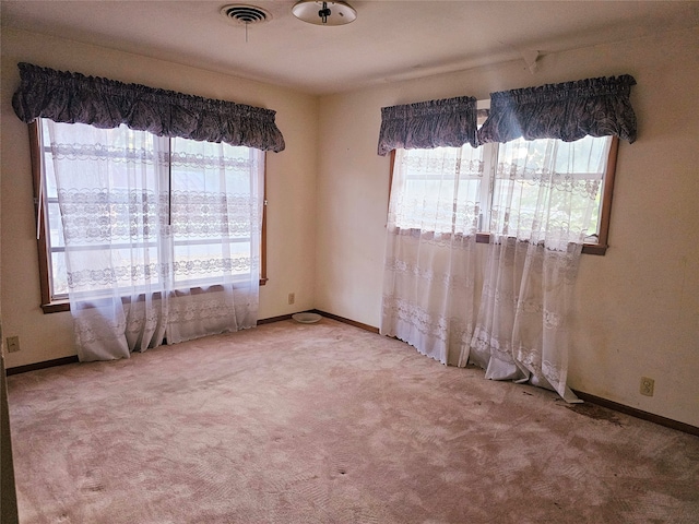 spare room with light colored carpet