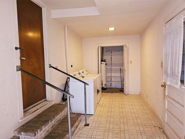 washroom featuring separate washer and dryer and water heater