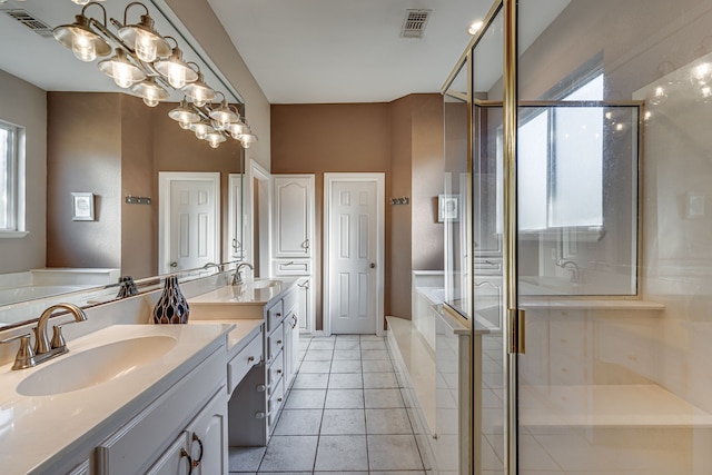 bathroom featuring tile patterned floors, plus walk in shower, and vanity