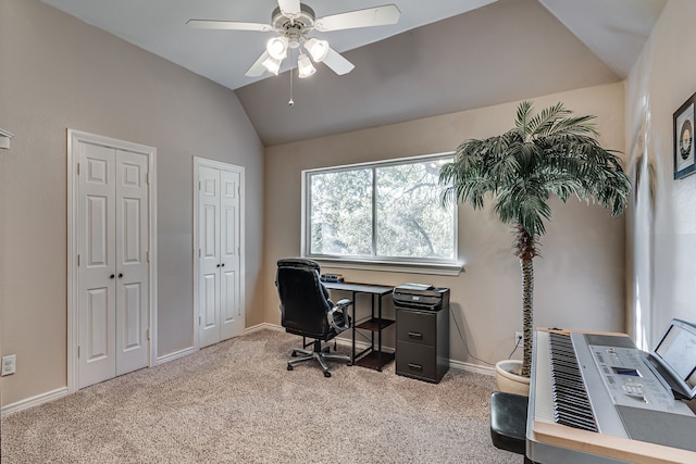 carpeted office with lofted ceiling and ceiling fan