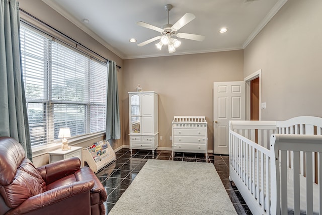 bedroom featuring ceiling fan, ornamental molding, and a crib