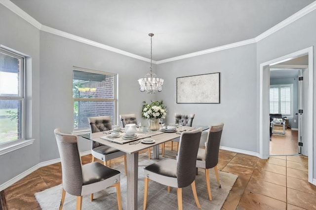 dining space with an inviting chandelier, tile patterned floors, and ornamental molding