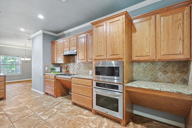 kitchen with tasteful backsplash, a chandelier, ornamental molding, stainless steel appliances, and light stone countertops