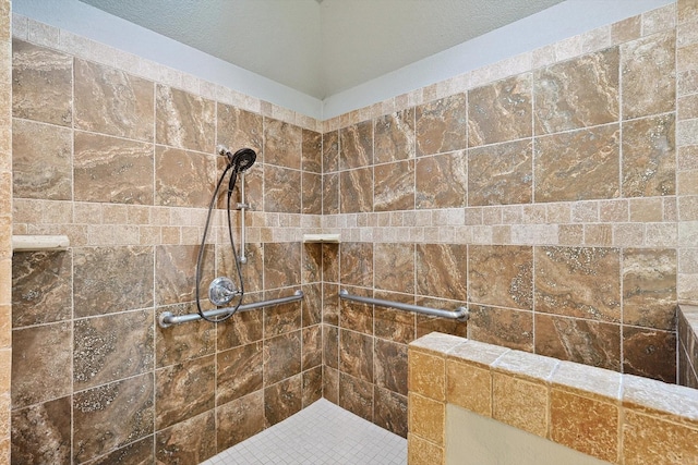 bathroom with tiled shower