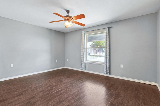 empty room featuring ceiling fan, hardwood / wood-style floors, and a textured ceiling