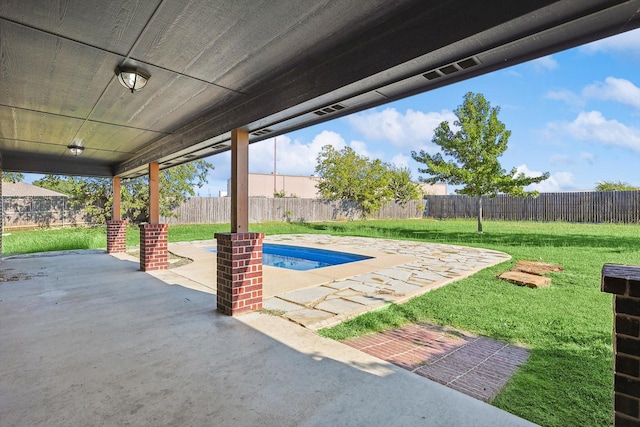 view of patio featuring a fenced in pool