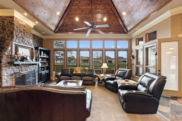 living room featuring ceiling fan, wood ceiling, high vaulted ceiling, a fireplace, and crown molding