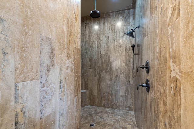 bathroom featuring a tile shower