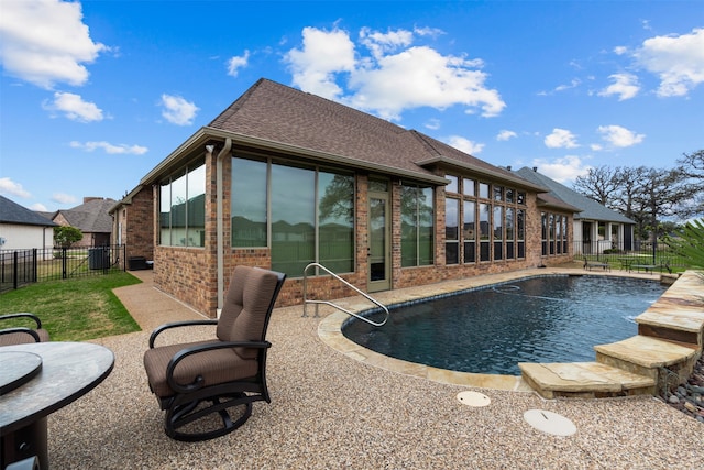 exterior space featuring a fenced in pool and a patio area