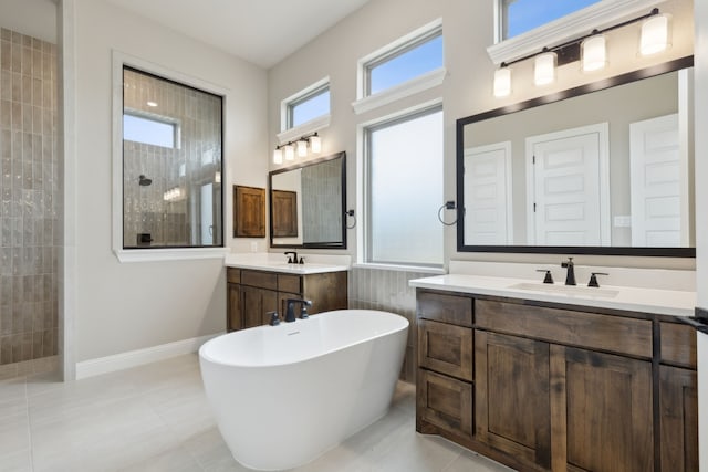 bathroom featuring tile patterned flooring, vanity, separate shower and tub, and plenty of natural light