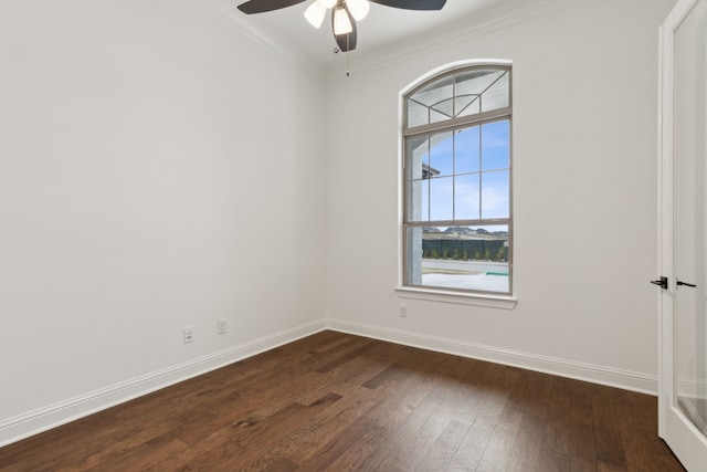 unfurnished room with dark wood-type flooring, ceiling fan, and ornamental molding