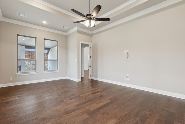 empty room featuring ceiling fan, dark hardwood / wood-style floors, and ornamental molding