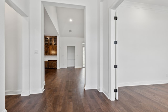 corridor featuring dark hardwood / wood-style flooring