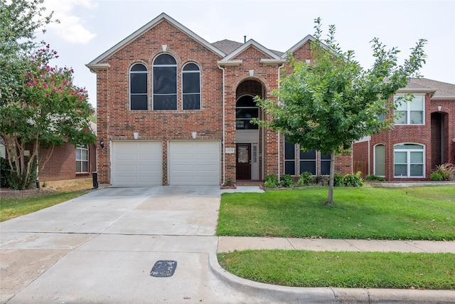 front facade featuring a garage and a front yard