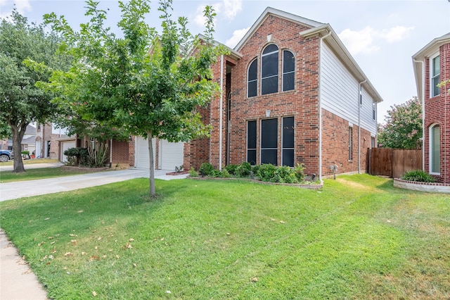 view of property featuring a garage and a front yard