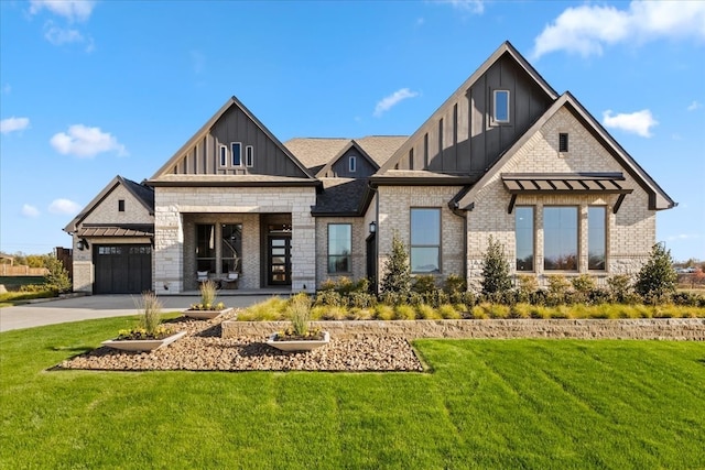 view of front of property featuring a garage and a front yard