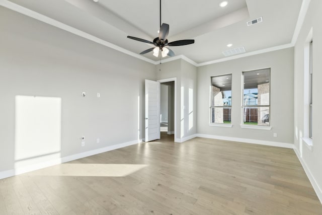 spare room featuring ceiling fan, crown molding, and light hardwood / wood-style flooring