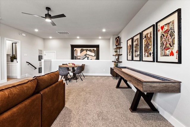 living room with carpet flooring and ceiling fan