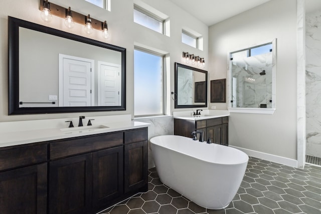 bathroom with vanity and separate shower and tub