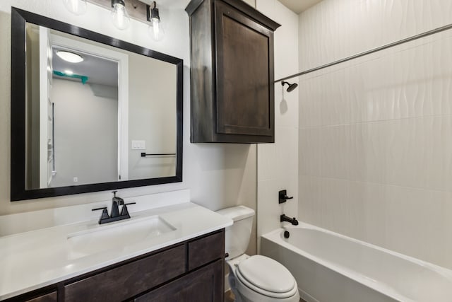 full bathroom with toilet, tiled shower / bath combo, and vanity