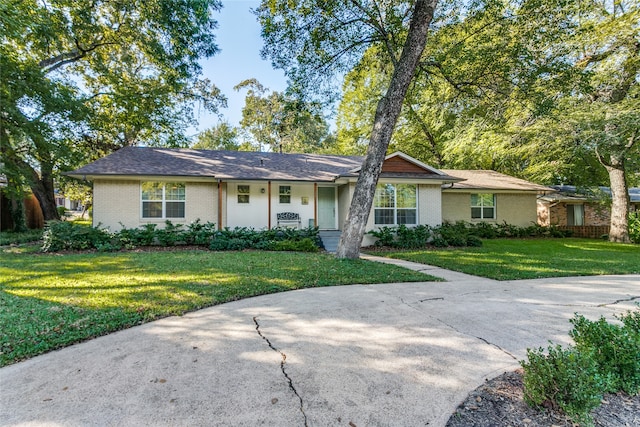 ranch-style home with a front yard