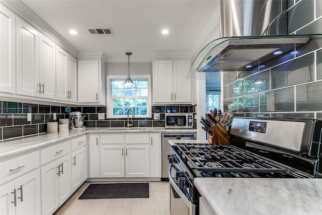 kitchen with sink, white cabinets, appliances with stainless steel finishes, extractor fan, and ornamental molding