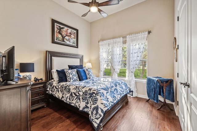 bedroom featuring ceiling fan and dark wood-type flooring