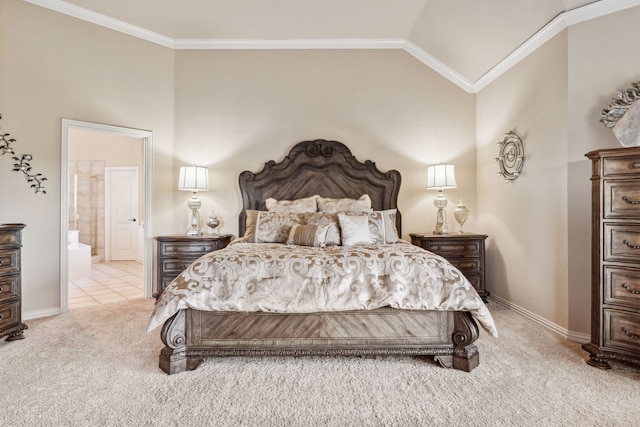 bedroom with crown molding, lofted ceiling, light carpet, and connected bathroom