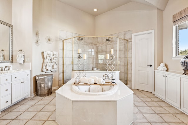 bathroom with tile patterned flooring, vanity, and independent shower and bath