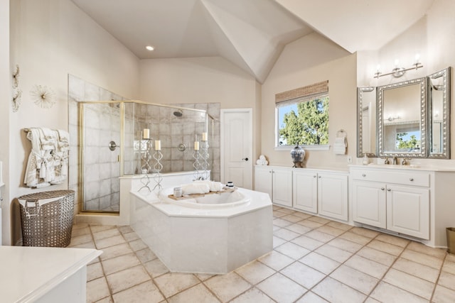 bathroom featuring tile patterned flooring, vanity, lofted ceiling, and plus walk in shower