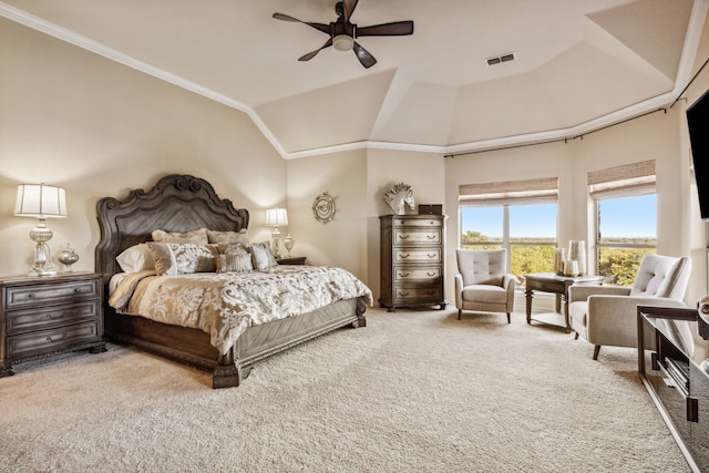 carpeted bedroom with vaulted ceiling, ceiling fan, and ornamental molding