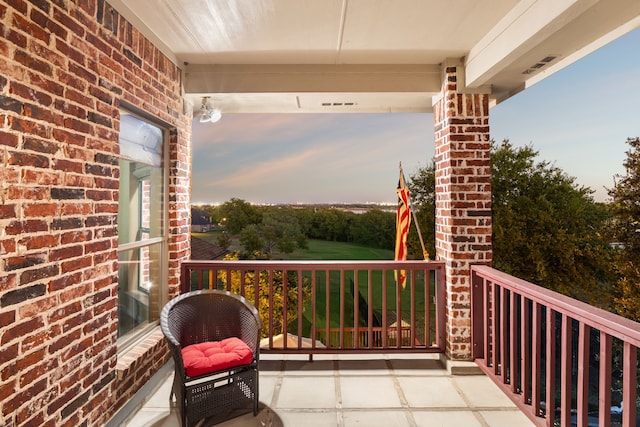 view of balcony at dusk