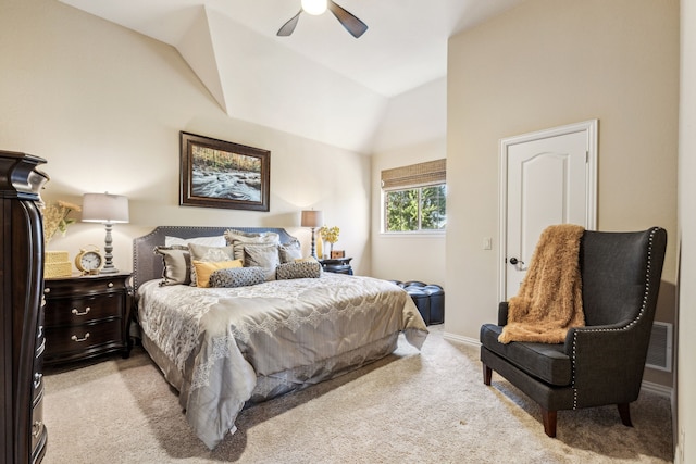 bedroom featuring ceiling fan, light colored carpet, and vaulted ceiling