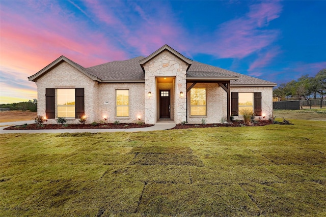 view of front of property with a yard