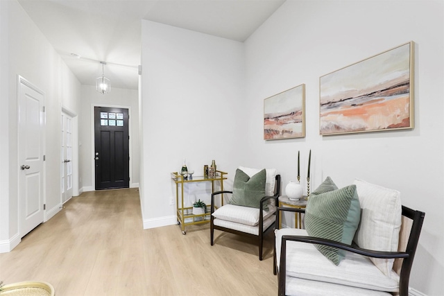 entrance foyer featuring a chandelier and light hardwood / wood-style flooring