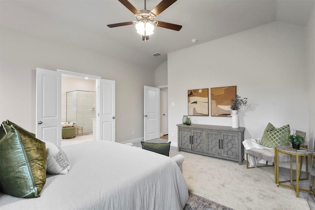 bedroom with ceiling fan, lofted ceiling, carpet floors, and connected bathroom