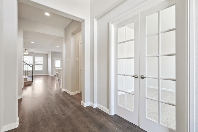 corridor featuring dark wood-style floors, recessed lighting, and baseboards