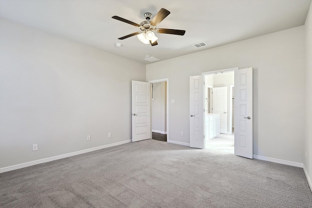 unfurnished bedroom featuring visible vents, baseboards, carpet, and ceiling fan