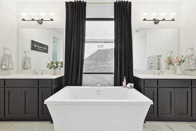 bathroom featuring vanity and a tub