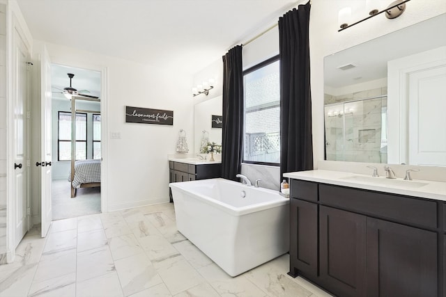 bathroom with ceiling fan, shower with separate bathtub, and vanity