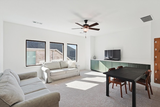 living room featuring ceiling fan and light colored carpet