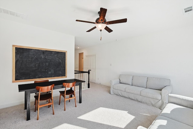 living room with light carpet and ceiling fan