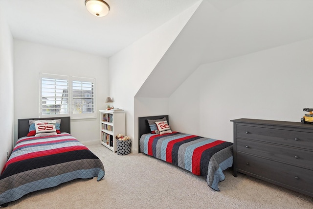 carpeted bedroom with vaulted ceiling