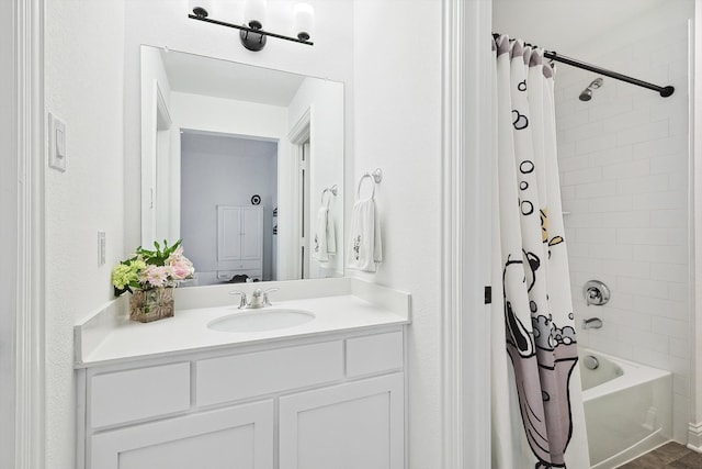 bathroom featuring shower / bath combination with curtain and vanity